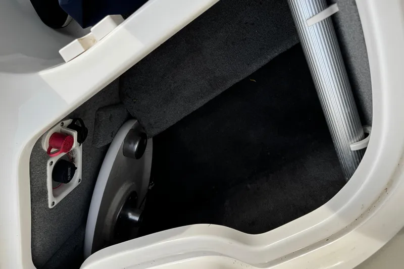 Slide: The Image of Interior view of 2008 Chaparral 256 SSi boat compartment with carpeted flooring. - 28