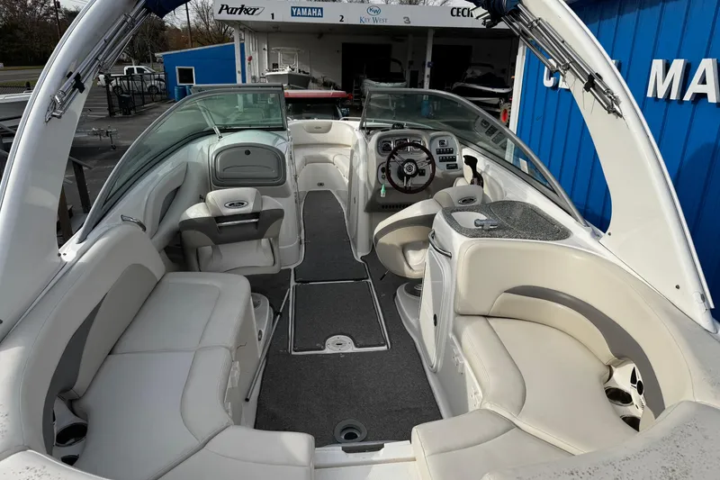 Slide: The Image of 2008 Chaparral 256 SSi boat interior with white seating and modern dashboard. - 29
