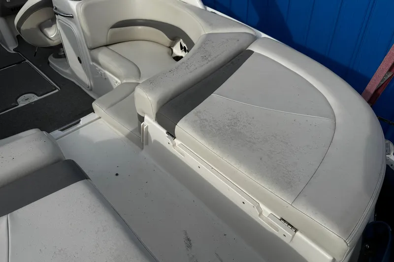 Slide: The Image of 2008 Chaparral 256 SSi boat interior with white and gray seating. - 30