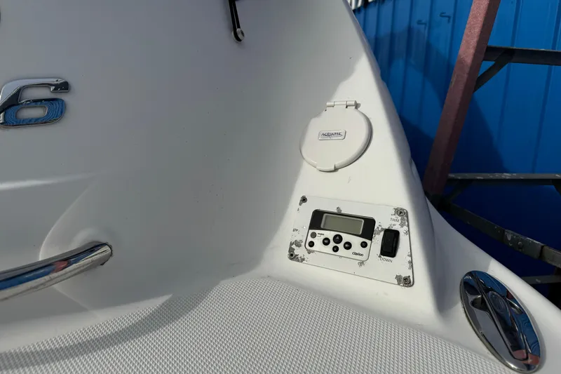 Slide: The Image of 2008 Chaparral 256 SSi boat dashboard with control panel and Aquatik cover. - 36