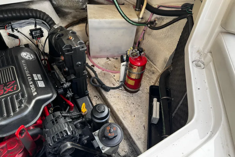 Slide: The Image of Engine compartment of 2008 Chaparral 256 SSi with Volvo Penta 5.7 GXI engine and fire extinguisher. - 38