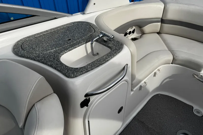 Slide: The Image of 2008 Chaparral 256 SSi boat interior with sink and seating area. - 7