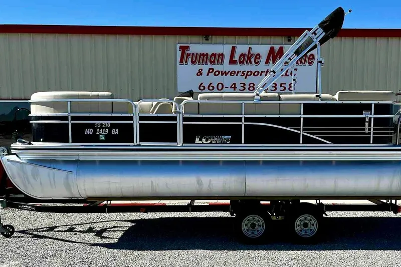 The Image of 2015 Lowe SS 210 pontoon boat on trailer at Truman Lake Marine dealership. - 0
