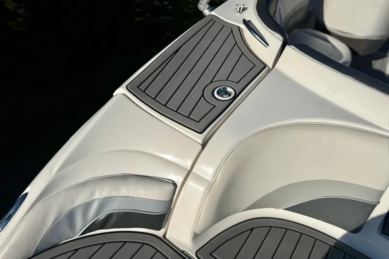 Slide: The Image of 2005 Yamaha Boats SX230 interior detail with sleek seating and stylish design. - 12