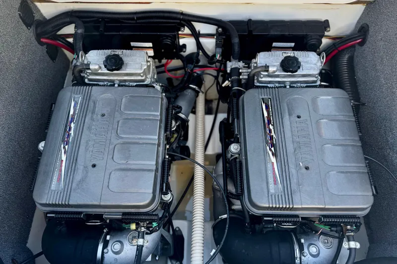 Slide: The Image of Twin engines of a 2005 Yamaha Boats SX230, showcasing detailed mechanical components. - 13