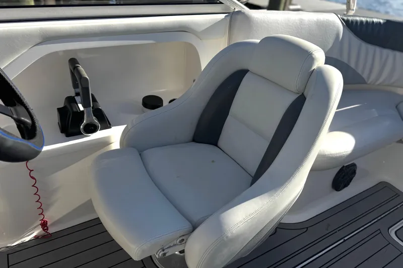 Slide: The Image of 2005 Yamaha Boats SX230 interior with steering wheel and throttle controls. - 3