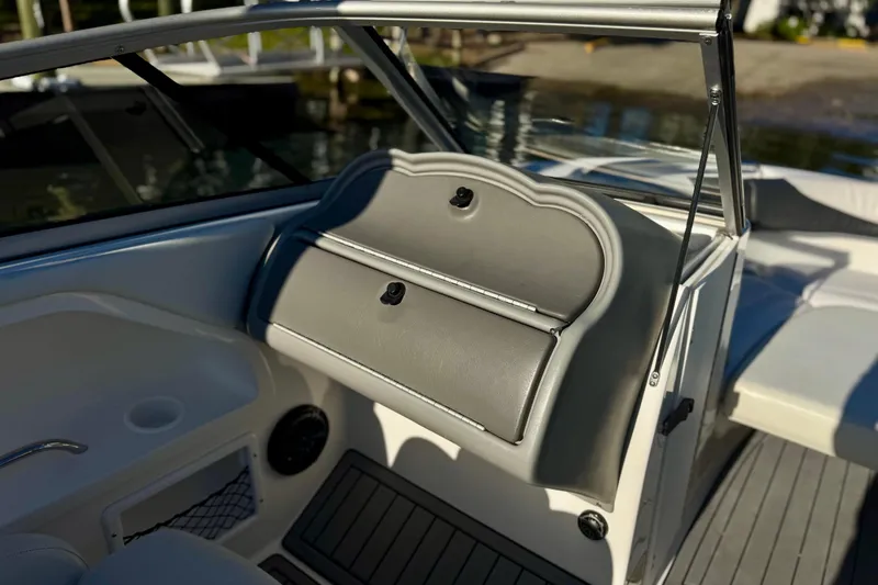 Slide: The Image of 2005 Yamaha Boats SX230 interior with glove compartment and seating area. - 5