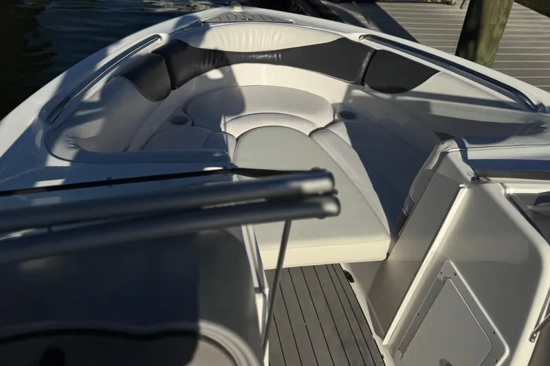 Slide: The Image of 2005 Yamaha Boats SX230 interior with cushioned seating and sleek design. - 7
