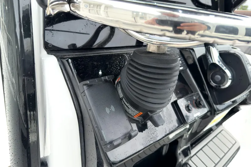 Slide: The Image of 2026 Tidewater 210 LXF boat dashboard with steering wheel and controls. - 13