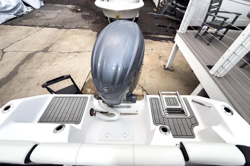 Slide: The Image of 2026 Tidewater 210 LXF boat with Yamaha outboard motor and swim platform. - 23