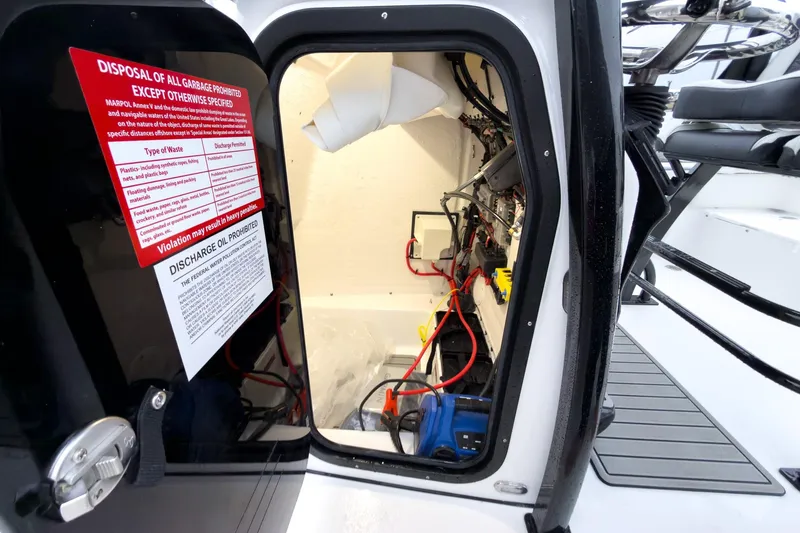 Slide: The Image of Interior view of 2026 Tidewater 210 LXF boat showing wiring and equipment. - 29