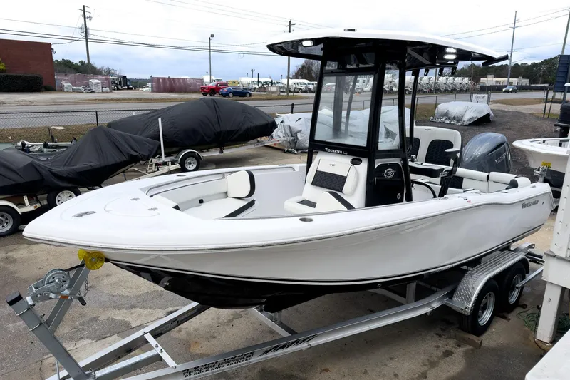 Slide: The Image of 2026 Tidewater 210 LXF boat on trailer, sleek design, white exterior, modern features. - 31