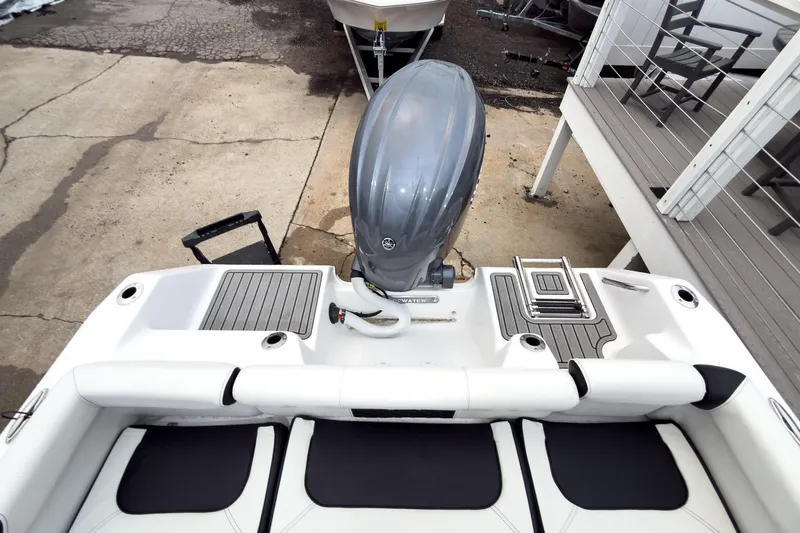 Slide: The Image of 2026 Tidewater 210 LXF boat with outboard motor and seating, viewed from above. - 33
