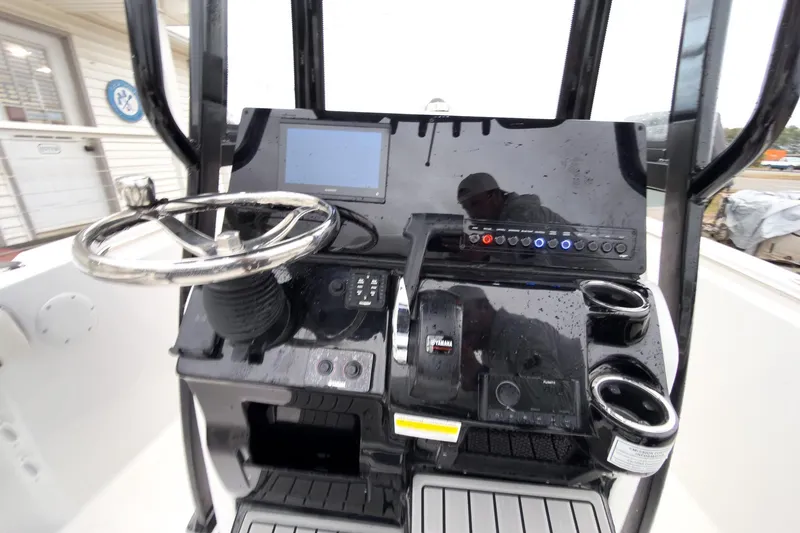Slide: The Image of 2026 Tidewater 210 LXF boat dashboard with steering wheel and control panel. - 34