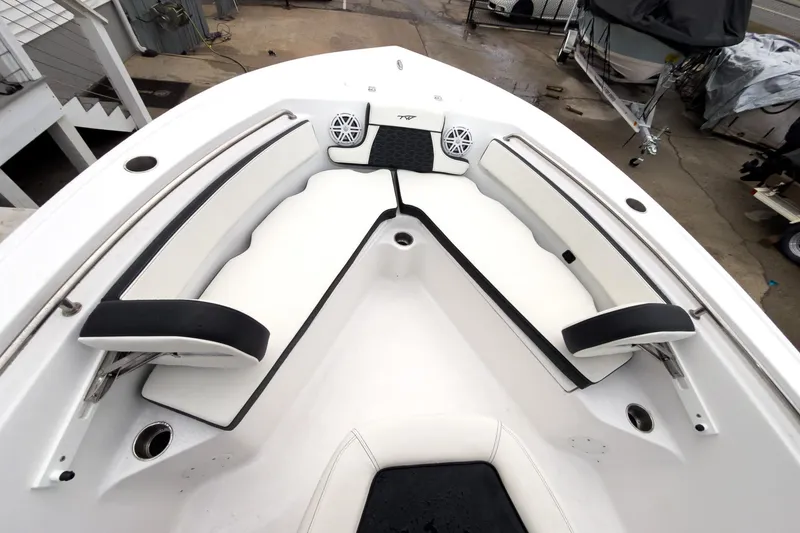 Slide: The Image of 2026 Tidewater 210 LXF boat interior with white seating and black accents. - 36