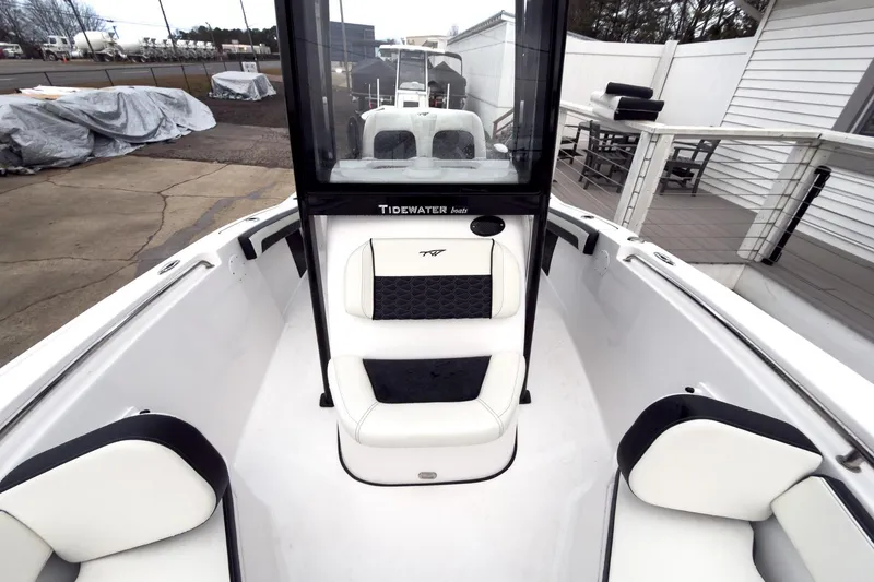 Slide: The Image of 2026 Tidewater 210 LXF boat interior with white seating and console. - 42