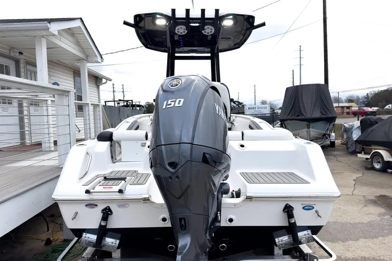 Slide: The Image of 2026 Tidewater 210 LXF boat with Yamaha 150 engine at a marina. - 5