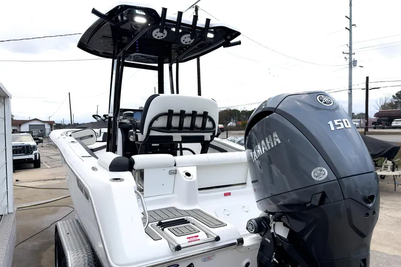 Slide: The Image of 2026 Tidewater 210 LXF boat with Yamaha 150 engine, docked outdoors. - 6
