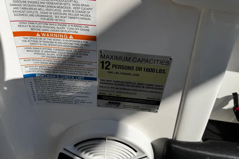 Slide: The Image of 2016 Chaparral 21 H2O Sport capacity warning label, maximum 12 persons or 1600 lbs. - 22