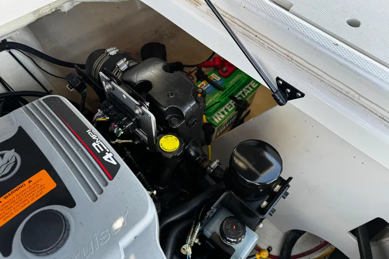 Slide: The Image of Engine compartment of 2016 Chaparral 21 H2O Sport with Interstate battery and 4.3 MPI engine. - 26