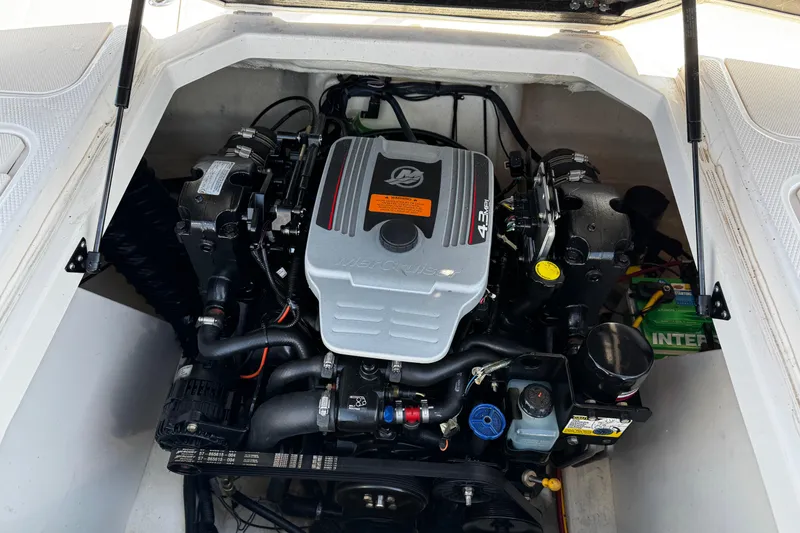 Slide: The Image of Engine compartment of a 2016 Chaparral 21 H2O Sport boat, featuring a MerCruiser 4.3L engine. - 29
