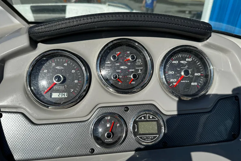 Slide: The Image of Dashboard of 2016 Chaparral 21 H2O Sport boat with gauges and controls. - 35