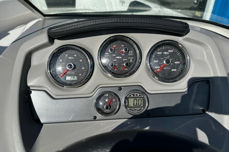 Slide: The Image of Dashboard of 2016 Chaparral 21 H2O Sport boat with gauges and controls. - 36
