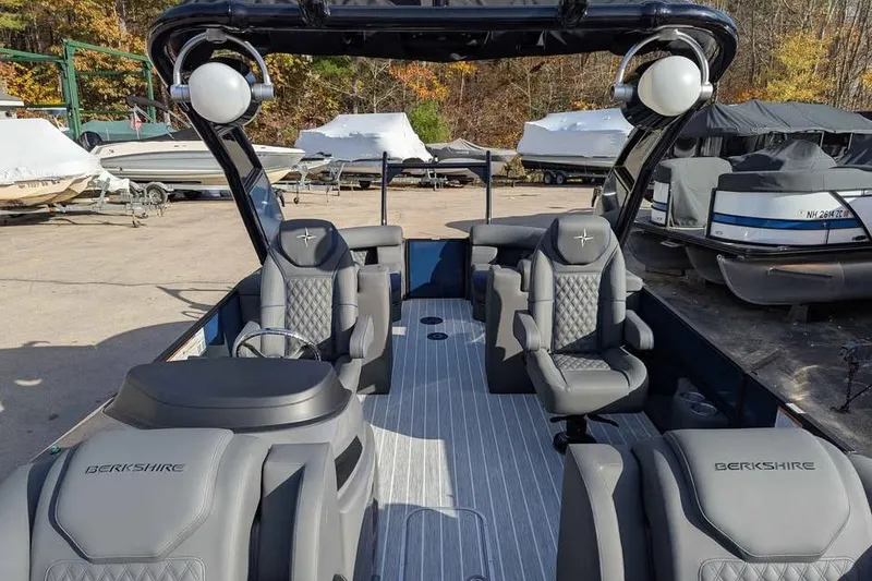 Slide: The Image of 2026 Berkshire 23RFX STS pontoon boat interior with luxurious seating and modern design. - 10