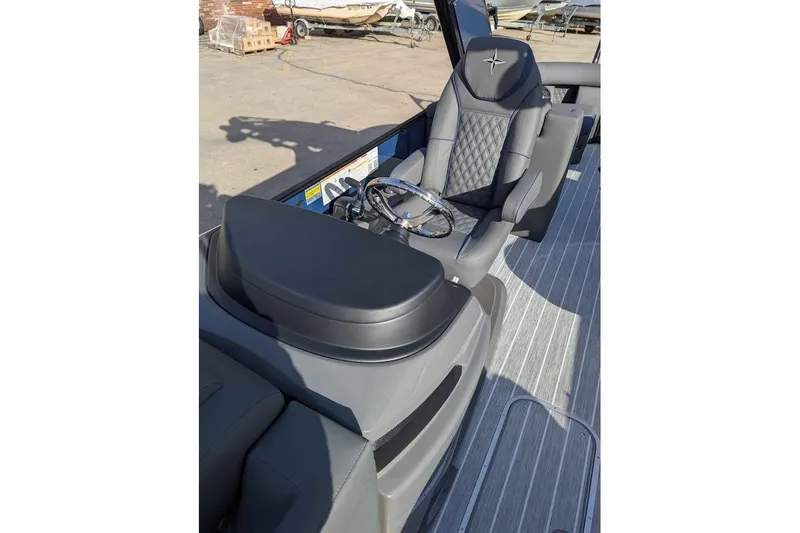Slide: The Image of 2026 Berkshire 23RFX STS boat interior with luxury seating and steering wheel. - 16