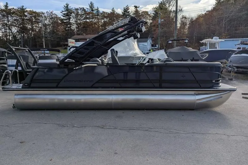 Slide: The Image of 2026 Berkshire 23RFX STS pontoon boat in a marina setting, side view. - 3