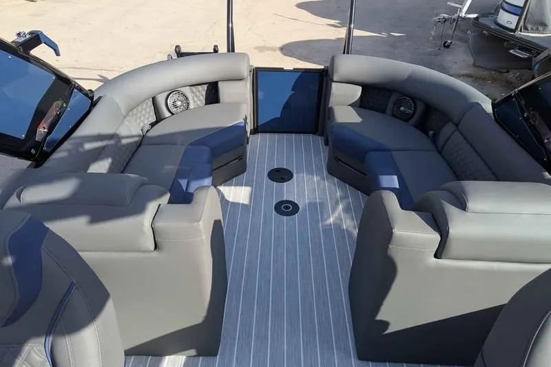Slide: The Image of 2026 Berkshire 23RFX STS pontoon boat interior with luxurious gray seating and modern design. - 8