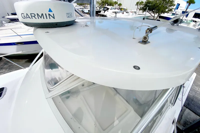 Slide: The Image of 2001 Pursuit 3000 Offshore boat with Garmin HD radar, docked in a marina. - 10