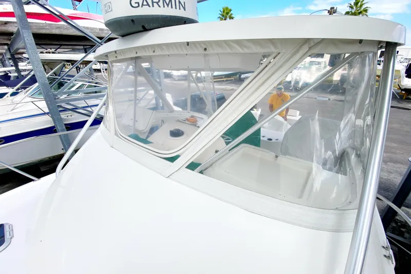 Slide: The Image of 2001 Pursuit 3000 Offshore boat with Garmin radar, docked at marina. - 11