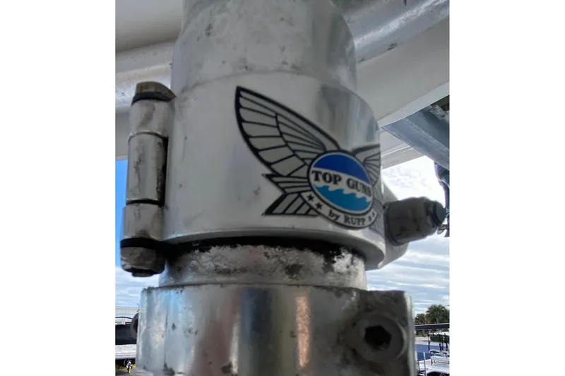 Slide: The Image of Close-up of a 2001 Pursuit 3000 Offshore boat part with "Top Gun" logo. - 24