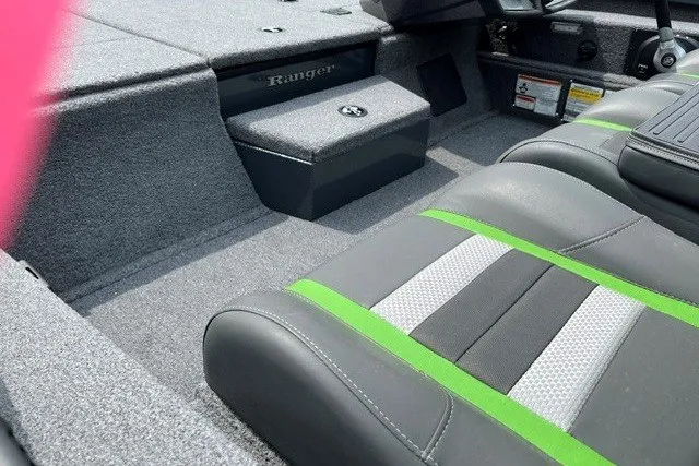 Slide: The Image of 2026 Ranger RT198P boat interior with gray and green seating, carpeted flooring. - 21