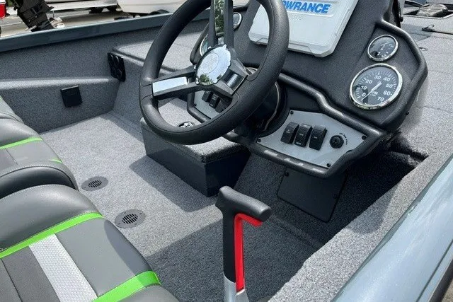 Slide: The Image of 2026 Ranger RT198P boat interior with steering wheel, gauges, and seating. - 12