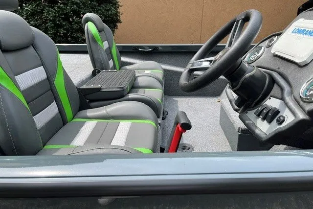 Slide: The Image of 2026 Ranger RT198P boat interior with green-accented seats and modern steering console. - 4