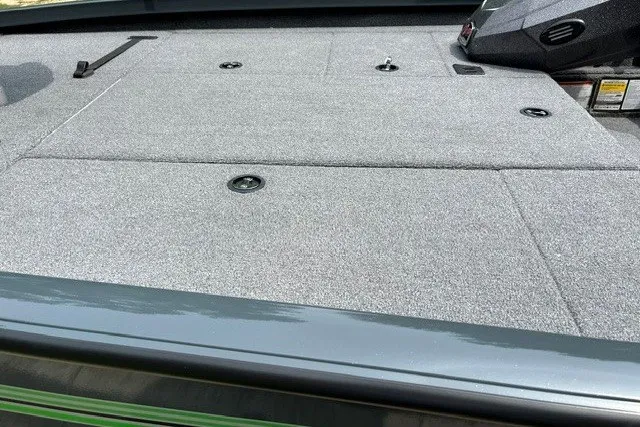 Slide: The Image of 2026 Ranger RT198P boat deck with gray carpet and storage compartments. - 101
