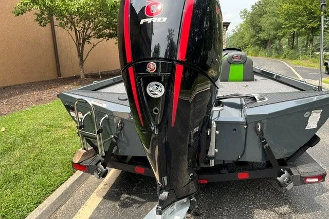 Slide: The Image of 2026 Ranger RT198P boat with powerful outboard motor, parked on a trailer. - 3