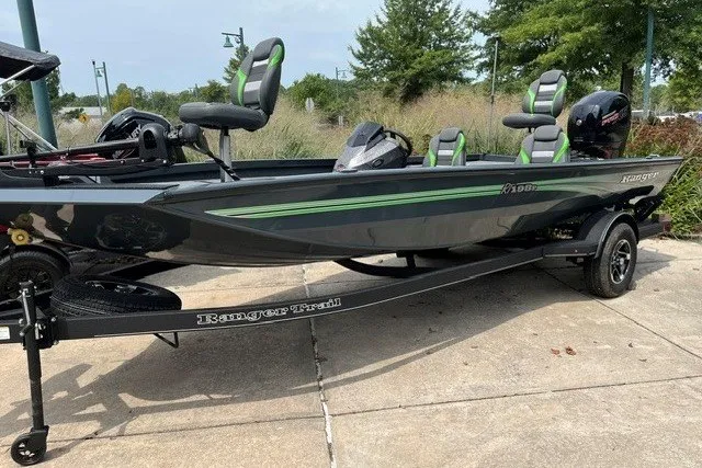Slide: The Image of 2026 Ranger RT198P fishing boat on trailer, sleek design with green accents. - 7