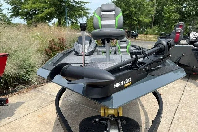 Slide: The Image of 2026 Ranger RT198P boat with Minn Kota trolling motor, parked outdoors. - 9
