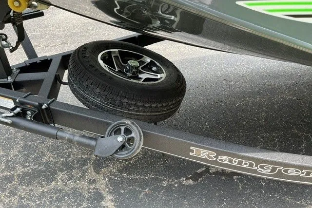 Slide: The Image of 2026 Ranger RT198P trailer with spare tire on asphalt surface. - 16