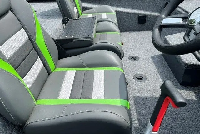 Slide: The Image of 2026 Ranger RT198P boat interior with gray and green seats, steering wheel, and carpeted floor. - 20