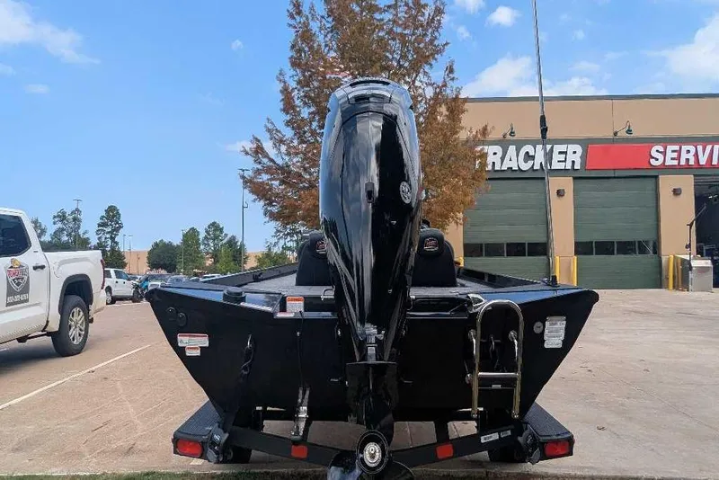 Slide: The Image of 2026 Ranger RT178C boat with outboard motor at service center. - 4