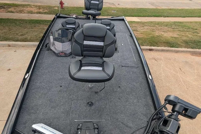 Slide: The Image of 2026 Ranger RT178C fishing boat with cushioned seats and carpeted deck. - 5