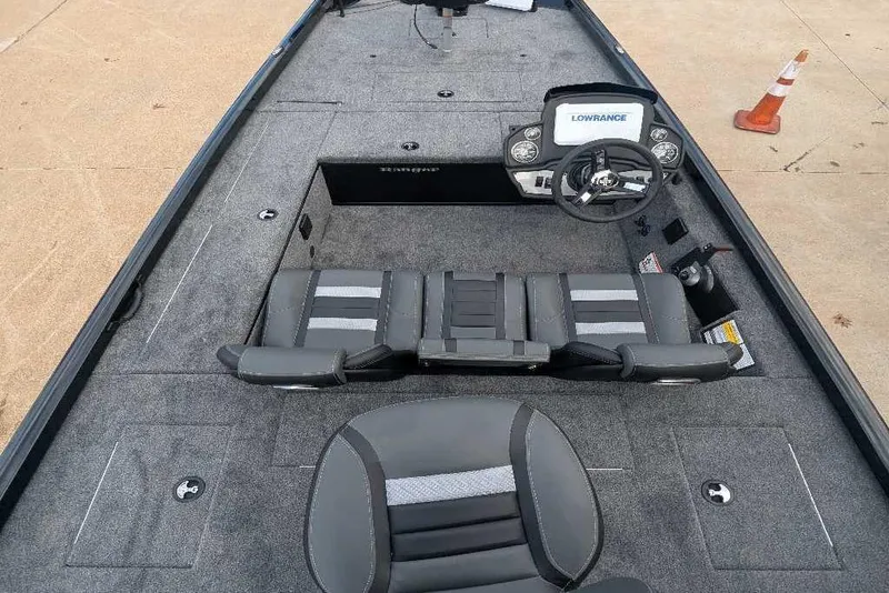 Slide: The Image of 2026 Ranger RT178C boat interior with steering console and seating, featuring Lowrance electronics. - 6