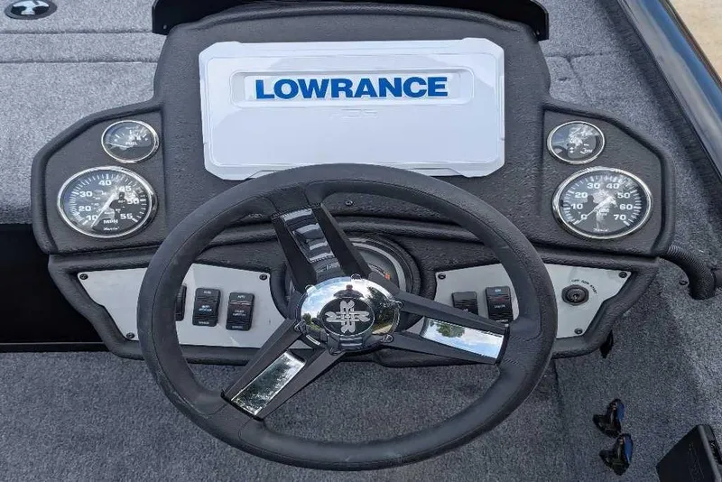 Slide: The Image of 2026 Ranger RT178C boat dashboard with Lowrance display and steering wheel. - 7