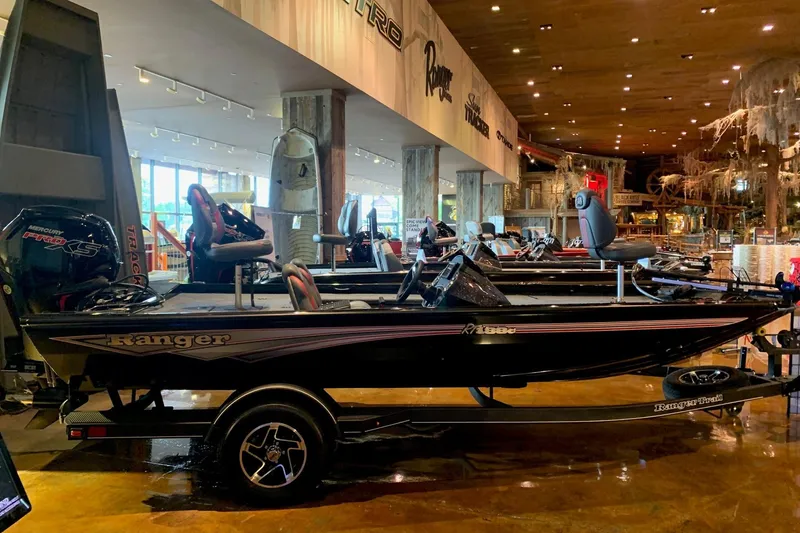 The Image of 2026 Ranger RT188C boat displayed indoors, featuring sleek design and modern seating. - 0