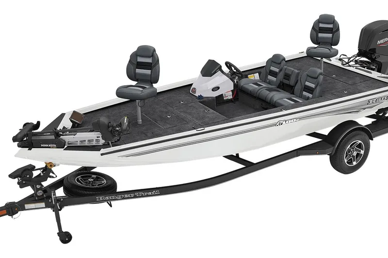 Slide: The Image of 2026 Ranger RT188C boat with outboard motor, parked near a marine store. - 62
