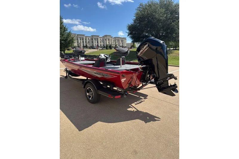Slide: The Image of 2026 Ranger RT178 boat with Mercury engine, parked outdoors on a sunny day. - 3